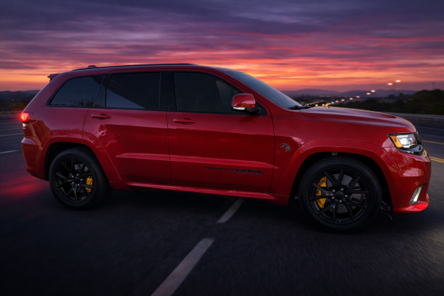 Red Jeep on a sunset highway.png